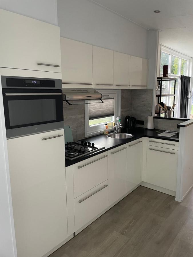 Knus Chalet Heidebloem Putten Bagian luar foto